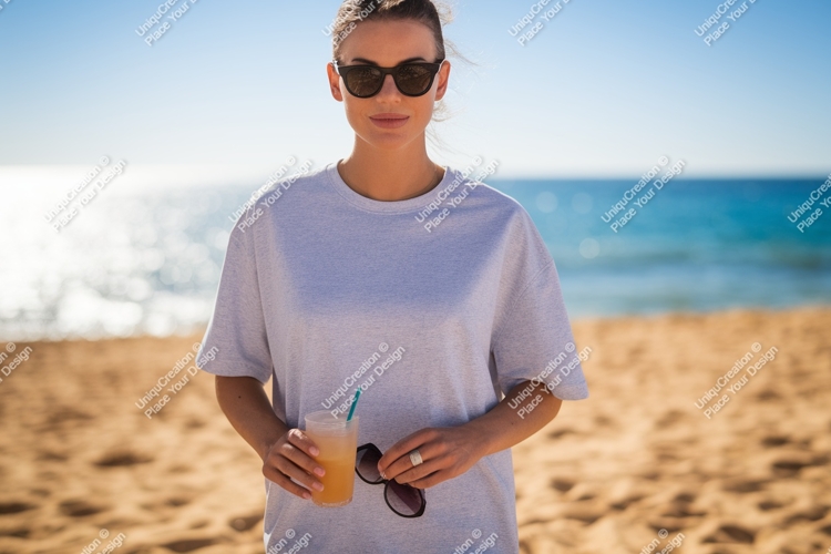 Woman holding drink sunglasses beach sand ocean