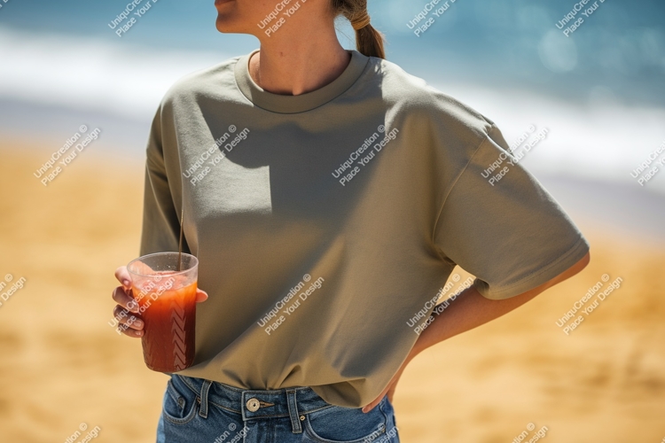 Woman holding drink on beach sand ocean