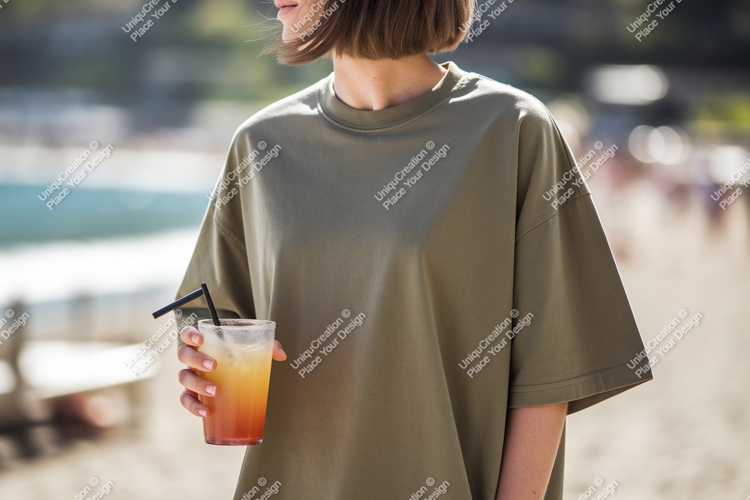 Woman holding orange drink on beach summer casual