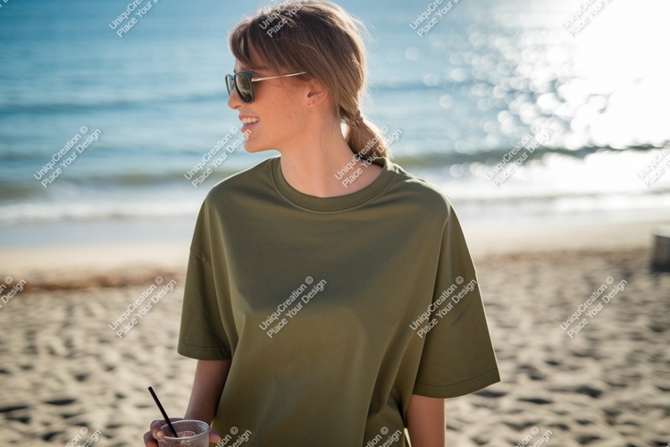 Woman wearing olive green t shirt on beach image