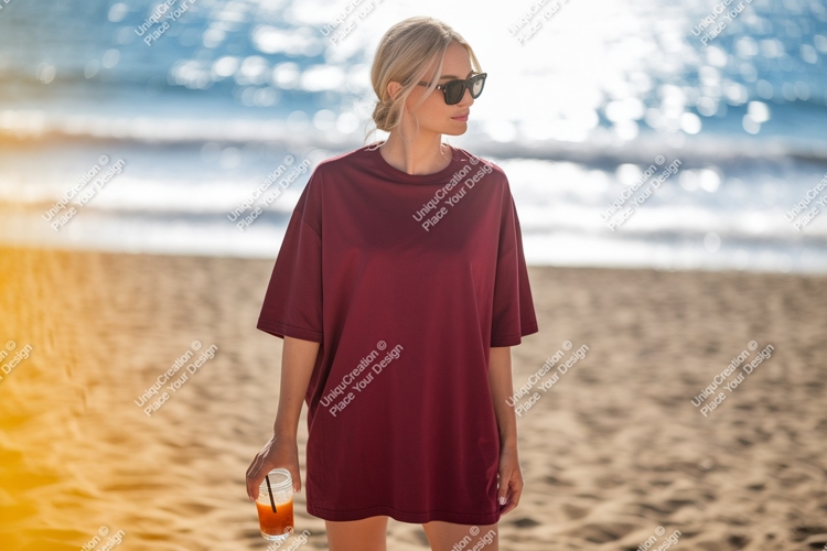 Woman wearing maroon t shirt holding drink image