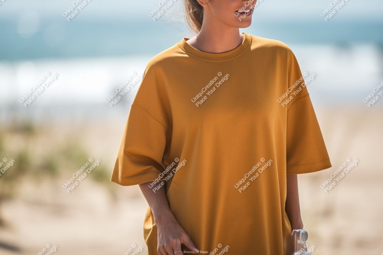 Woman wearing mustard yellow t shirt beach