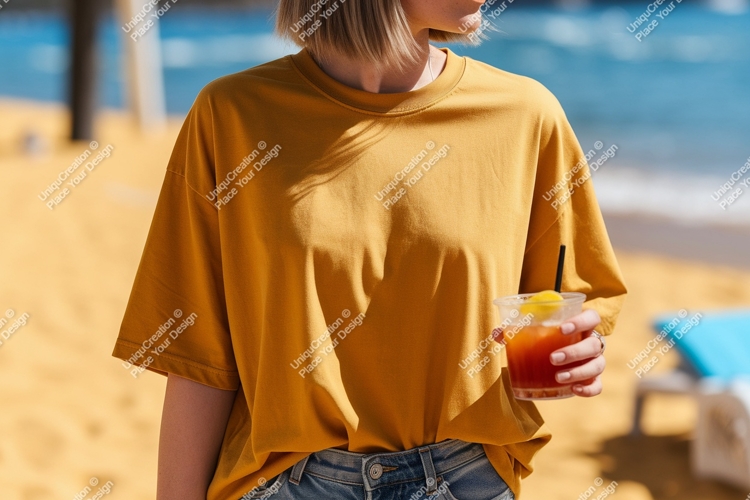 Woman holding drink on beach yellow