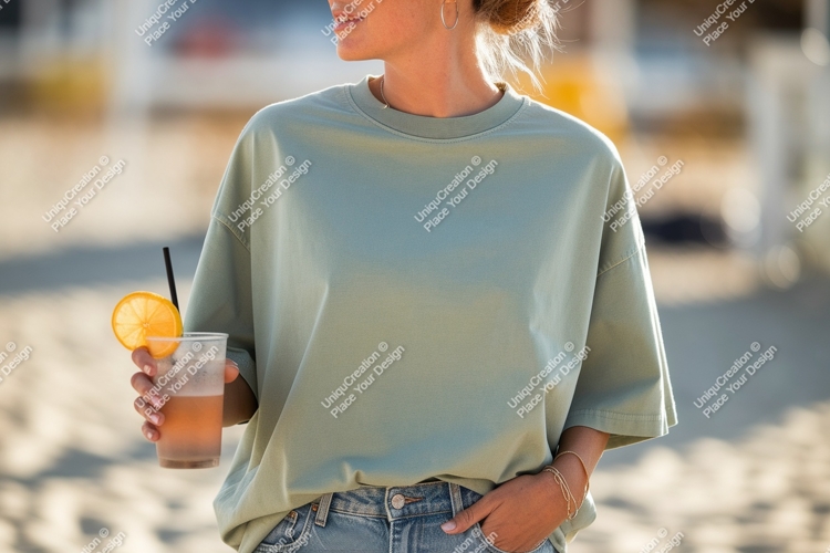 Woman wearing green t shirt holding drink image