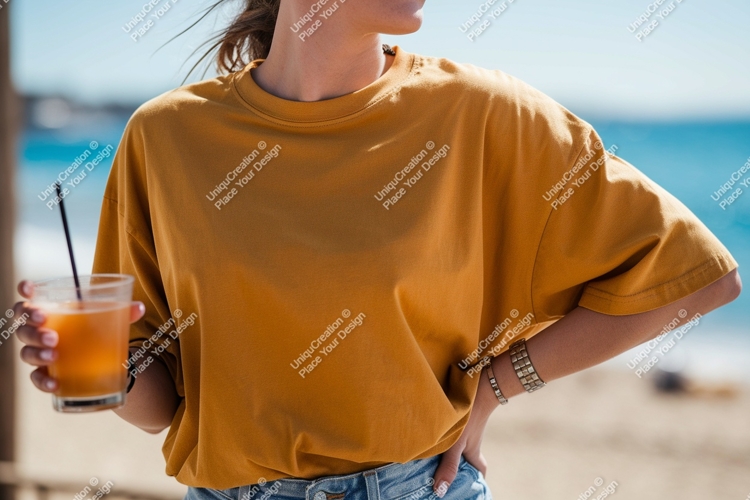 Woman wearing mustard t shirt holding orange drink