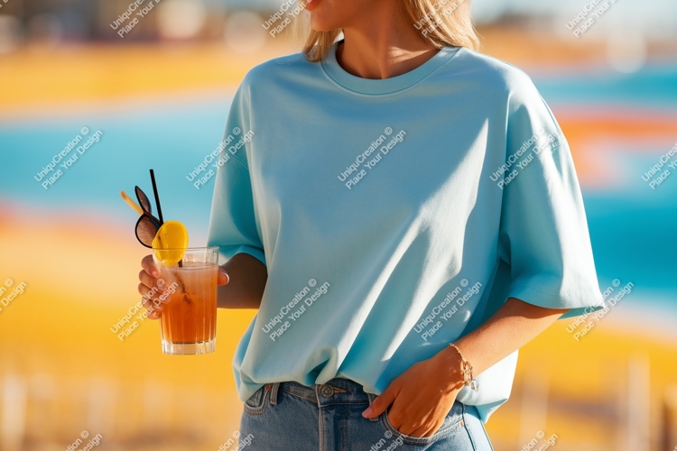 Light blue shirt holding orange drink glass