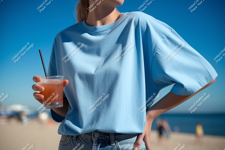 Person holding drink on beach blue