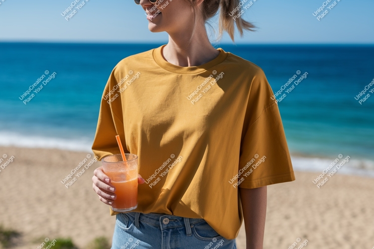 Woman holding orange drink on beach ocean summer
