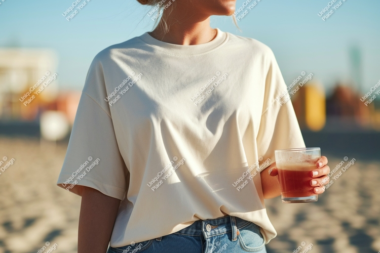 Cream shirt blue jeans holding drink image