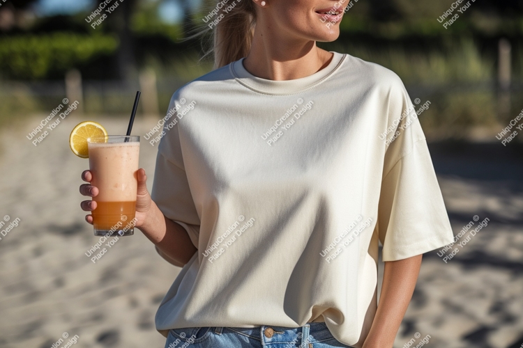 Woman holding refreshing beverage on sandy shore drink
