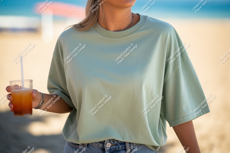 Woman wearing green t shirt holding drink image