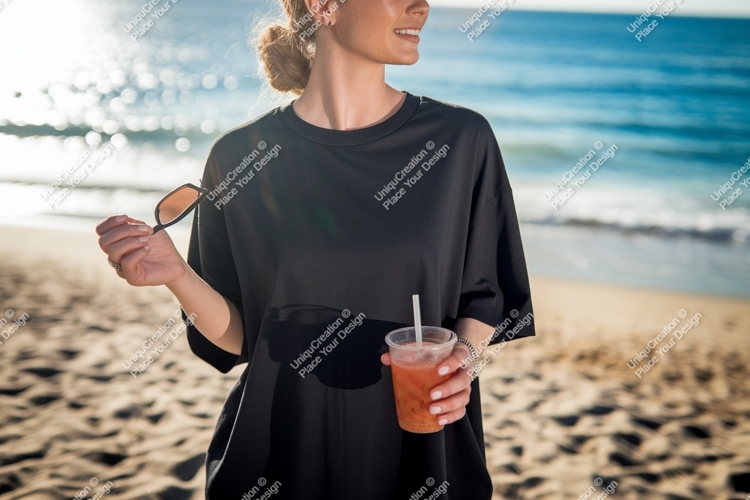 Woman holding drink sunglasses beach black t-shirt