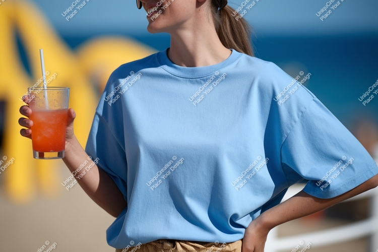 Woman wearing blue shirt holding drink glass