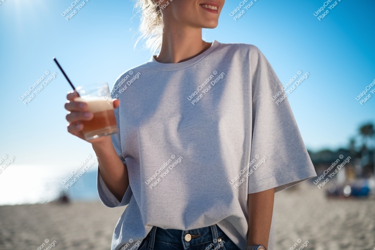 Woman holding drink on beach summer casual example image 1