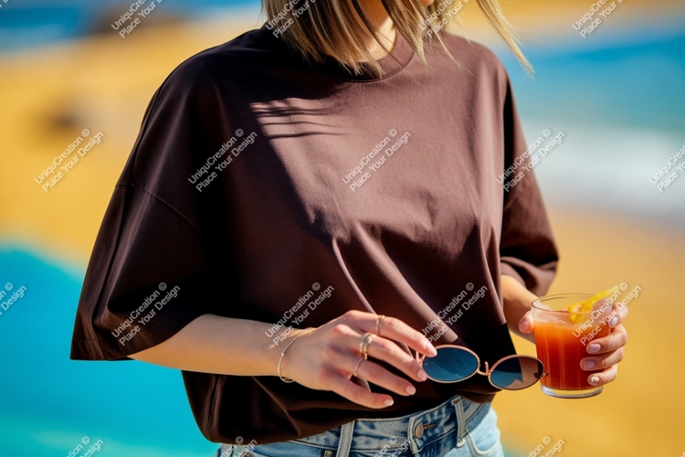 Brown shirt person holding drink sunglasses image