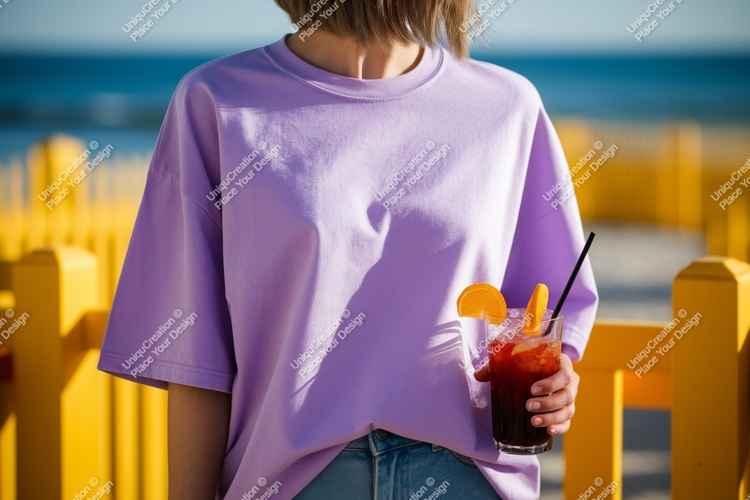 Lavender shirt person holding drink image