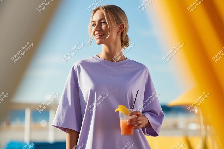 Woman wearing lavender shirt holding orange drink image