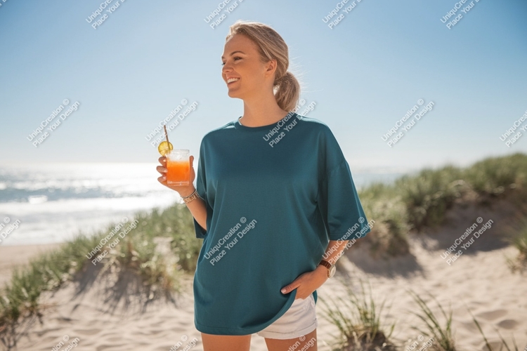 Woman holding drink on beach ocean sand