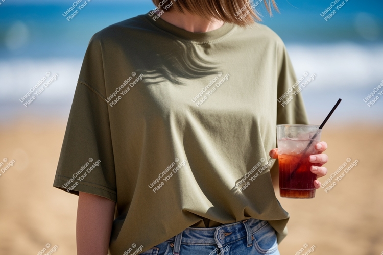 Olive green t shirt holding drink image