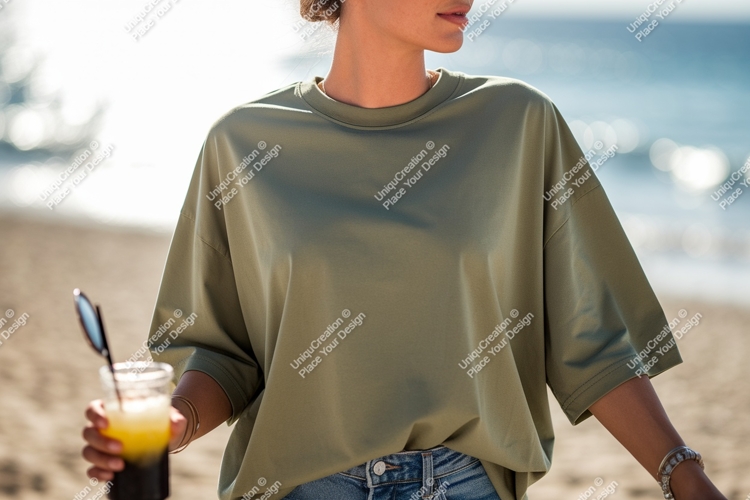 Woman wearing olive green t shirt holding drink image
