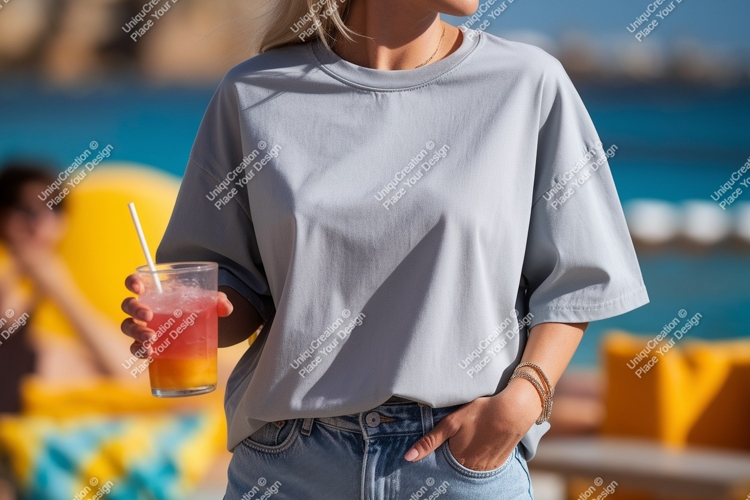 Woman holding colorful drink wearing grey t shirt image