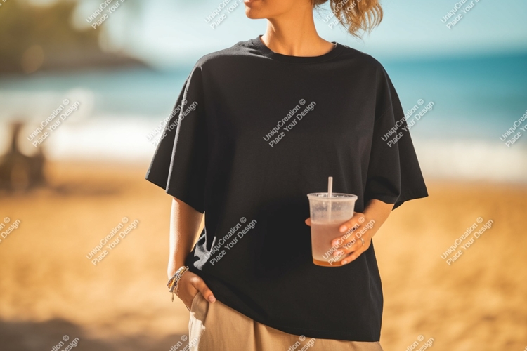 Black shirt beverage beach sand