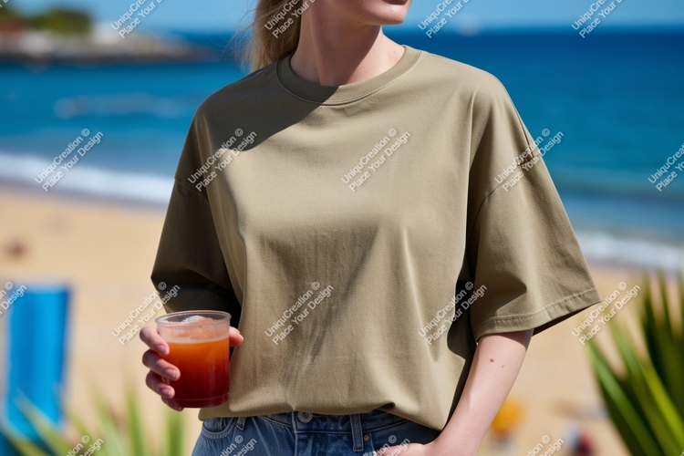 Woman wearing olive t shirt holding drink image