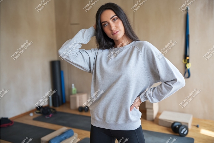 Woman in gray sweatshirt poses mockup