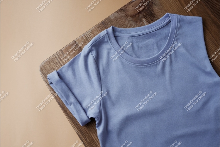 Blue tshirt on wood surface mockup