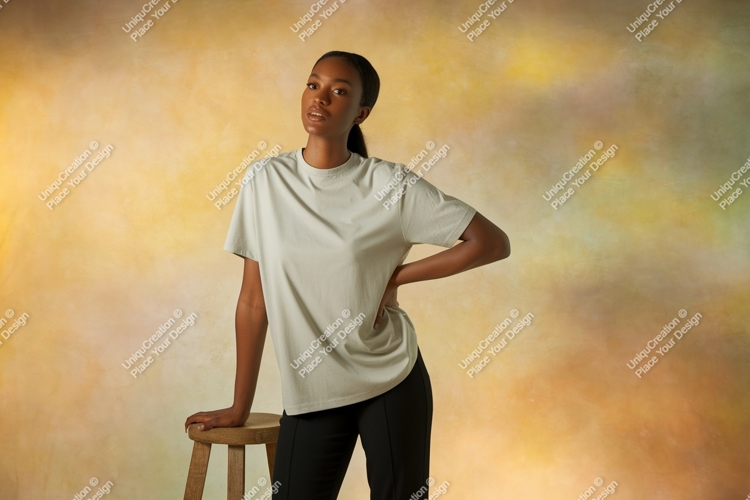 Woman wearing light grey t-shirt and black pants