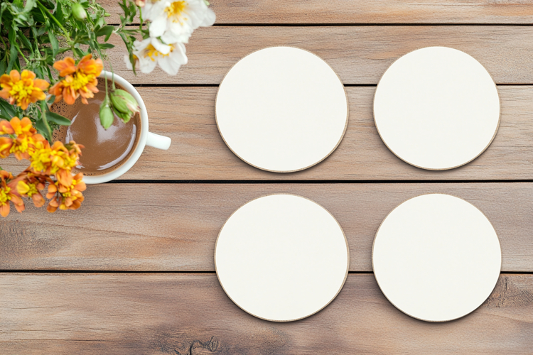Four Blank Round Coasters Mockup with Cup and Flowers