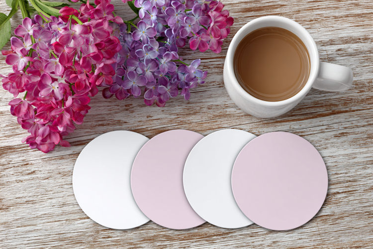 Four Blank Round Coasters Mockup with Cup and Flowers