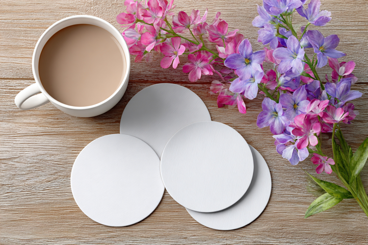 Four Blank Round Coasters Mockup with Cup and Flowers
