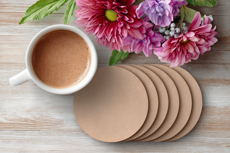 Four Blank Round Coasters Mockup with Cup and Flowers