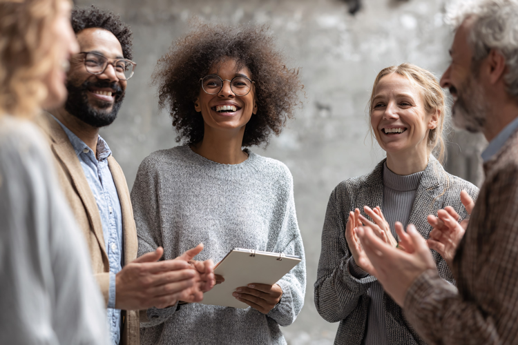 Diverse Office Team Celebrating Success with Laughter