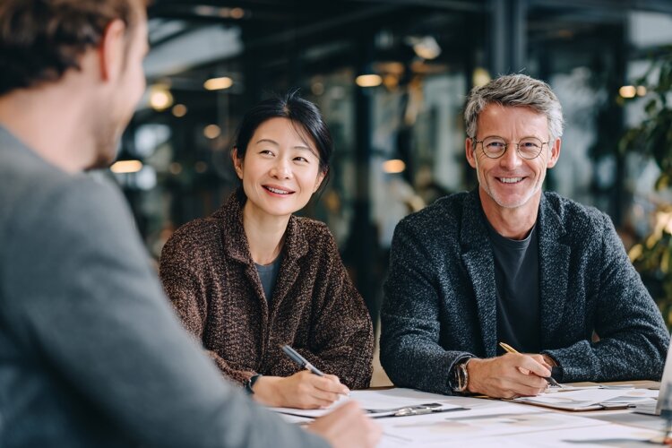 Smiling Business Team Meeting Together example image 1