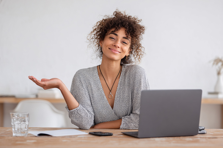 Smiling Woman Working on Laptop