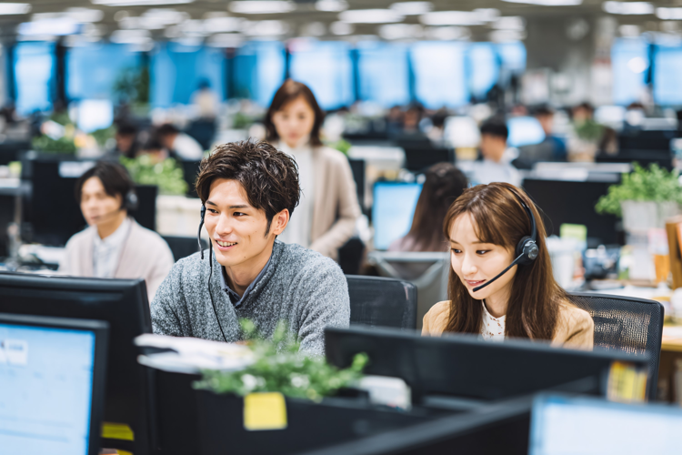 Smiling Diverse Team Working in Modern Office Call Center,