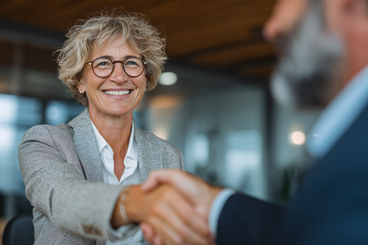 Businesswoman Shaking Hands with Colleague