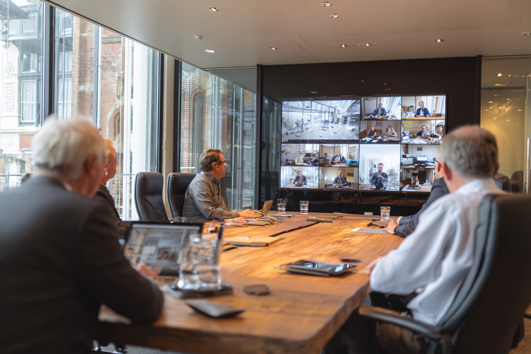 Business Team in Glass Meeting Room