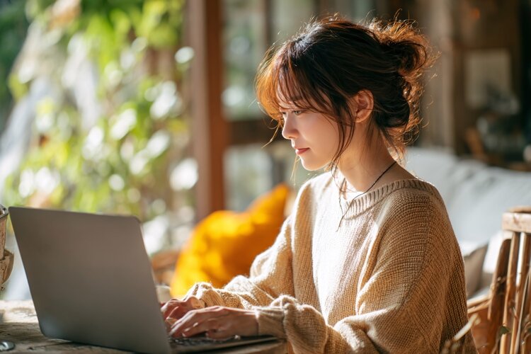 Woman Working on Laptop at Home example image 1
