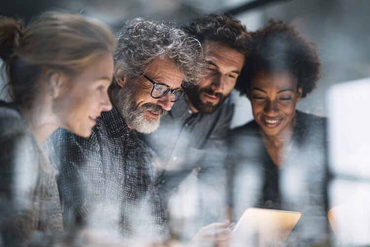 Businessman Smiling During Team Meeting example image 1