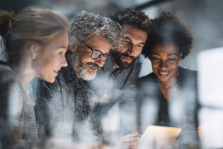 Businessman Smiling During Team Meeting