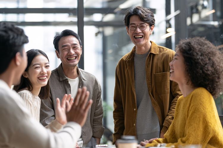Office workers collaborating, focused on computer screens