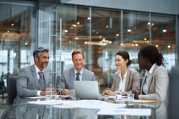 Diverse Team Meeting in Glass Conference Room example image 1