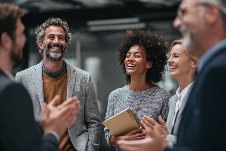 Diverse business team laughing happily during meeting, succe example image 1