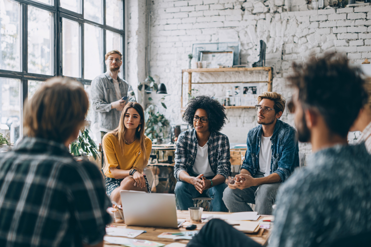 Diverse business team in modern office brainstorms ideas