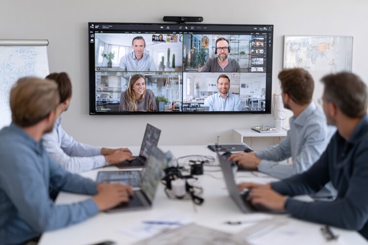 Diverse Business Team Collaborating on Video Conference Call example image 1