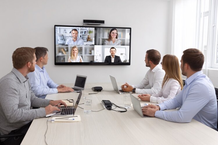 Diverse Business Team Video Conferencing in Modern Office example image 1