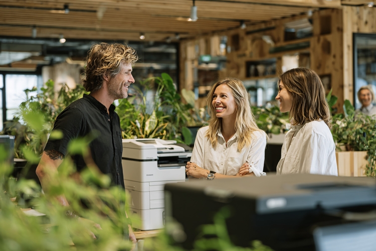 Diverse office team collaborates happily, modern workplace,
